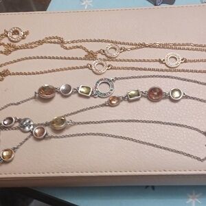 Gold and silver toned necklaces.